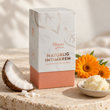 Biosan Naturlig Intimkrem med kokos, ringblomster og sheasmør på en lys steinoverflate.