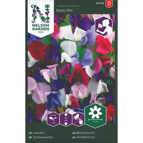 Lav blomsterert i flere farger i blomsterbed