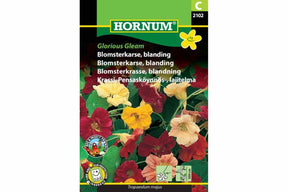 Fargerik blanding av blomkarser som vokser tett og frodig.