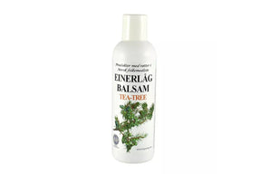 Flaske med Einerlåg tea tree-balsam for naturlig hårpleie.