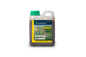 Flaske med økologisk flytende gjødsel for blomster.