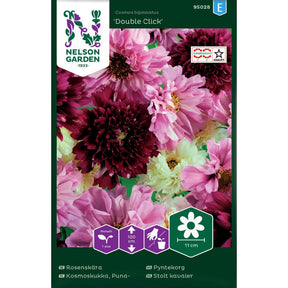 Pyntekorg Double Click med fylte blomster i hvitt og rosa i blomsterbed