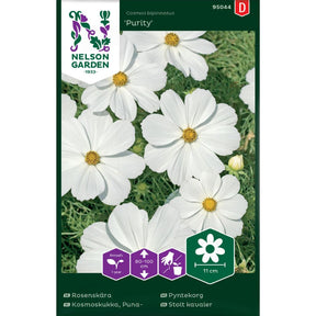 Pyntekorg Purity med rene hvite blomster i lyst blomsterbed