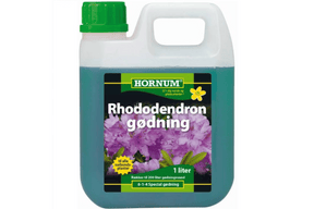 Flaske med flytende gjødsel til rhododendron og surjordsplanter