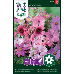 Sommerblomster i rosa toner i blomsterbed